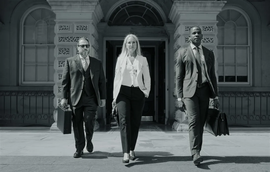 Three lawyers leaving Osgoode Hall.