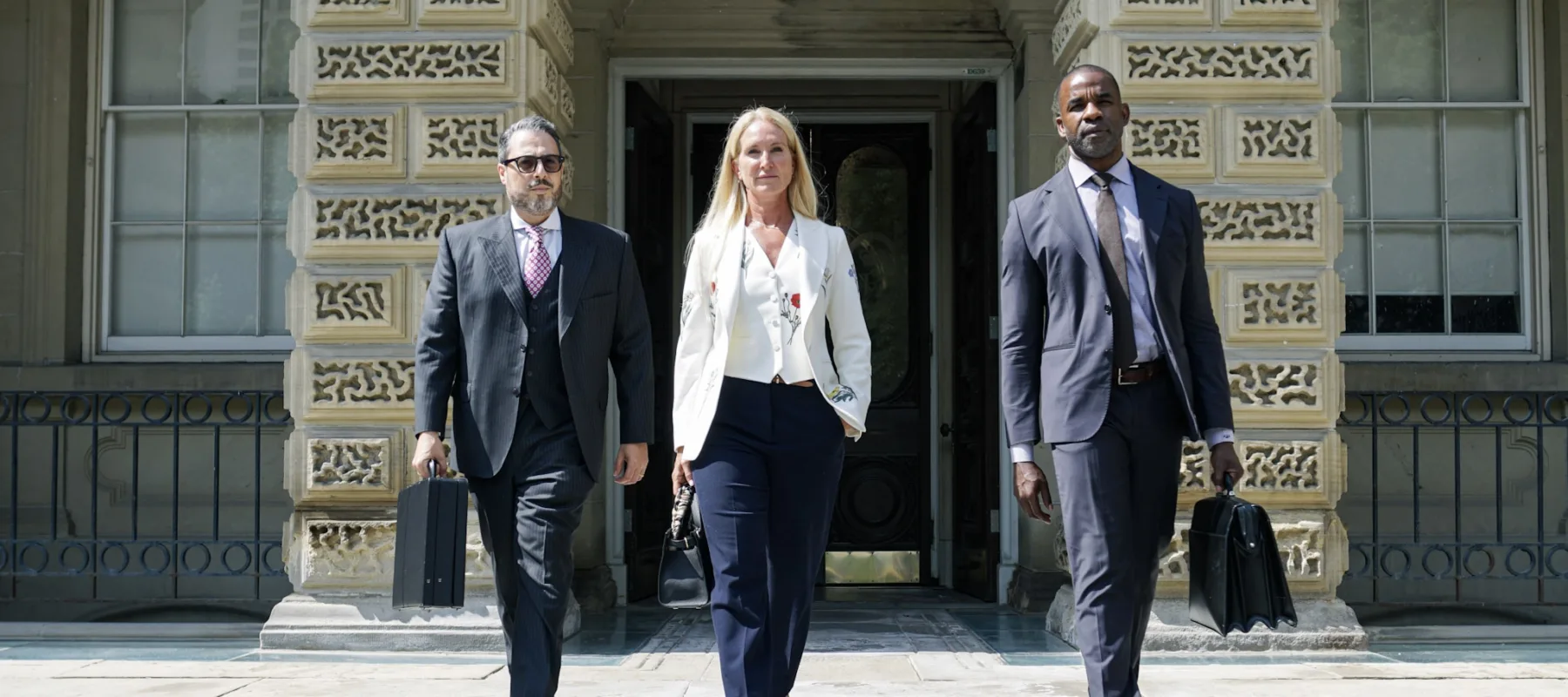 Three lawyers leaving Osgoode Hall.